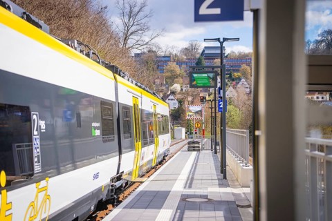 Urban environment with modern train on a track under cloudy sky, Hermann Hesse Bahn, ZOB, Calw,