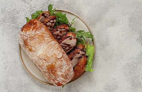 Sandwich with duck breast and arugula, balsamic sauce, on a light plate, breakfast, homemade, no