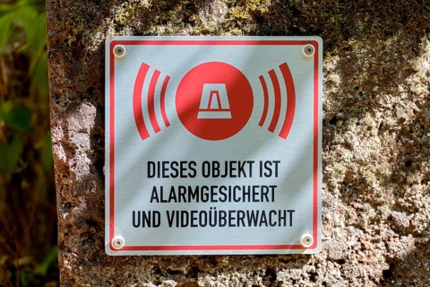 Sign for video surveillance by alarm system, video camera, Michelnau Quarry, Vogelsberg Volcanic