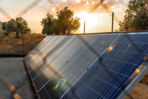 Solar panels capture the sun's energy at sunset in La Rioja, Spain, showcasing sustainable