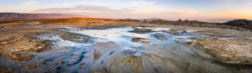 Wide panoramic view of Chachuna mud volcanoes with vibrant colors.Georgia