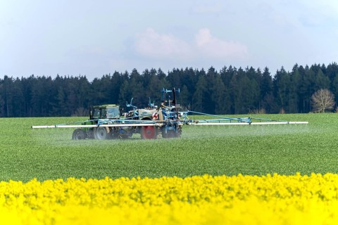 Agriculture, pesticide being sprayed on a field in spring, Swabian Alb, Baden-Württemberg, Germany