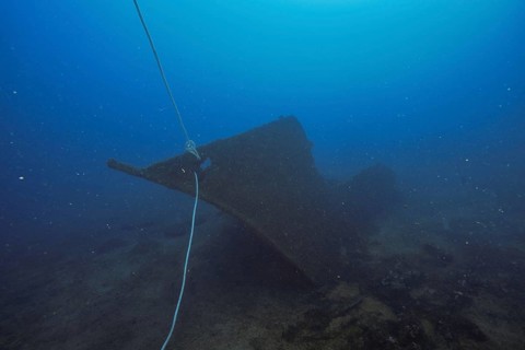 Part of an old wreck resting quietly on a sandy seabed, dive site wreck Le Vapeur, Giens peninsula,
