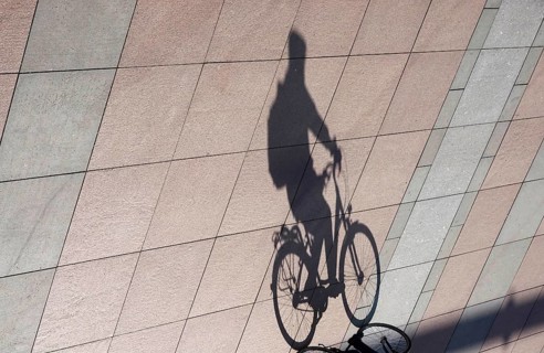 Cyclist with shadow, Winter, Saxony, Germany