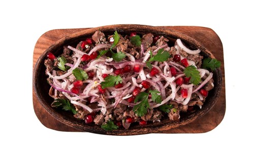 Kuchmachi, a traditional Georgian dish, in a clay Ketsi plate, close-up