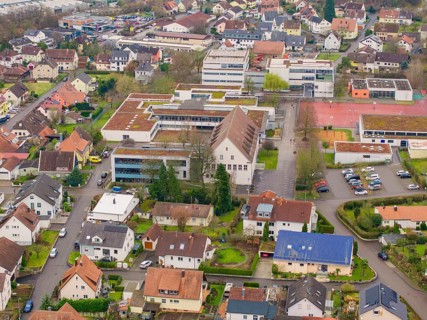 Aerial view of an urban neighbourhood with a large school and surrounding houses, Großbottwar,