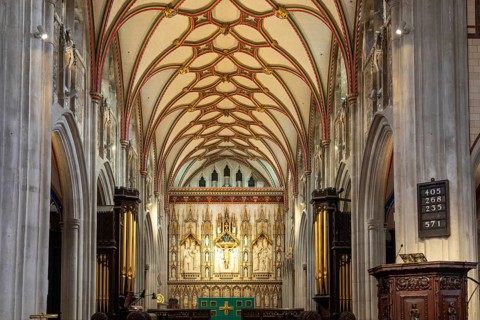 Fan-vaulted ceiling view to altar reredos, Church of Saint Mary, Ottery St Mary, Devon, England, UK