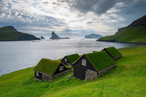 Traditional houses in the village of Bøur, Tindhólmur and Drangarnir, Vágar Island, Faroe Islands,