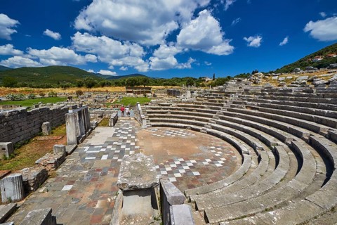 Ecclesiasterion, Roman ruins of a theatre with green surroundings under cloudy sky, ancient site,