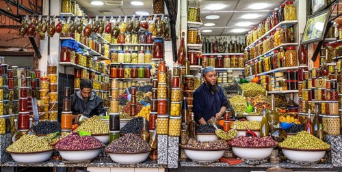 Stalls selling pickled olives, lemons and other vegetables, souk, bazaar, Marrakech, Maghreb,