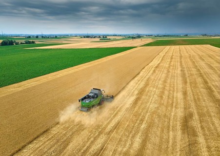 Combine harvester harvesting wheat on a field in the vertile and fruitful of Langes Feld north of