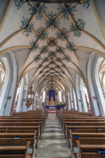 Interior with Gothic mesh vault and high altar, Holy Trinity parish church, founded in 1364,