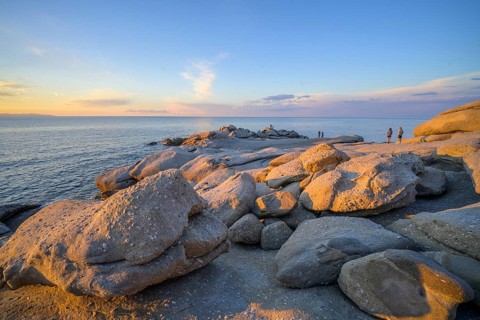 Rock formations in the evening light on, Capo Sant Andrea, Marciana, Livorno Province, Italy
