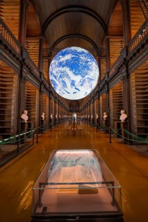 Impressive library with lively globe display and old books, Trinity Collage, Dublin, Ireland