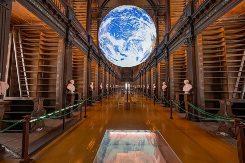Impressive library with illuminated globe and classic busts, Trinity Collage, Dublin, Ireland