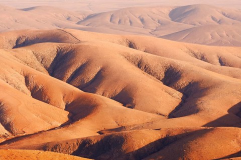 View of the barren and eroded landscape from the Mirador Morro Velosa viewpoint, Fuerteventura,