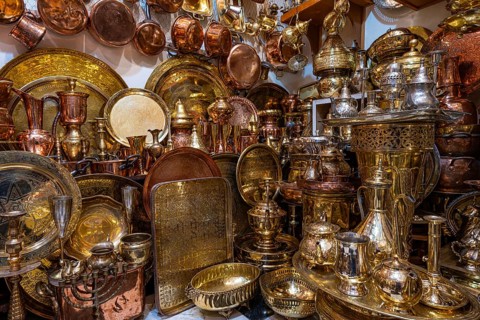 Brass and copper vessels, plates and trays displayed for sale in a shop, Souk, Bazaar, Maghreb,