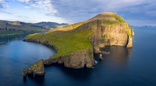 Drangarnir rock formation on the steep coast of the island of Vágar, Faroe Islands, Denmark