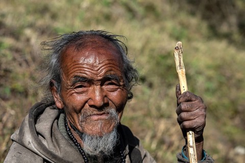 Portrait, elderly Nepalese man, native of the Tsumba Tibetan ethnic group, Tsum Valley, Himalayas,