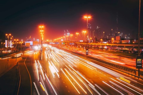 Panorama Dubai heavy night night traffic on Sheikh Zayed Road after work rush hour traffic. Light