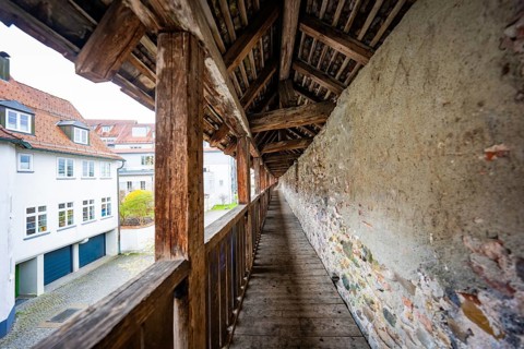 Covered wooden walkway along an old city wall, rustic and historic ambiance, Isny, Allgäu, Bavaria,