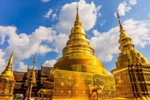Gilded temple towers, chedi, stupas, in the Wat Phra Singh Buddhist temple complex, Chiang Mai Old