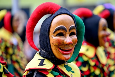 Member of a fools' guild in traditional Haes, fools' clothes, during the carnival procession in