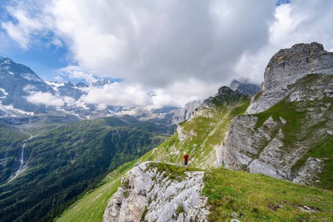 Mountaineers in front of picturesque mountain scenery at the summit of Tanzbödeli, mountain