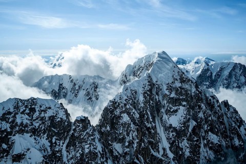 Summit of high mountains with glaciers, extreme ridge of Mount Huntington, 3731 m, aerial view,