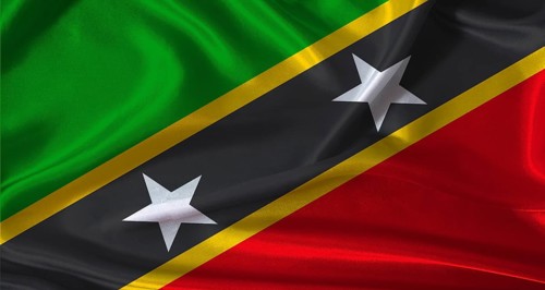 National flag of Saint Kitts and Nevis with cloth texture. Saint Kitts and Nevis flag with