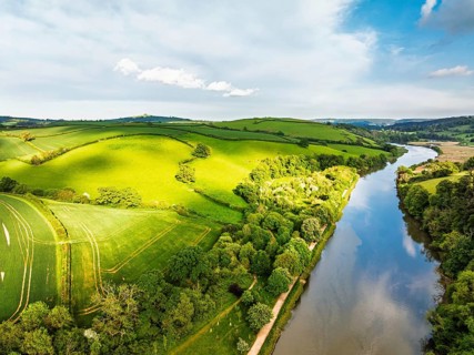 Farms and Fields over Totnes and River Dart from a drone, Devon, England, United Kingdom