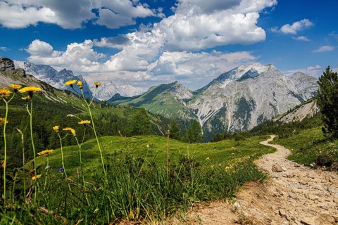 Distant view of the Kawendel Mountains with rocky mountain trail and green meadows, Kawendel,