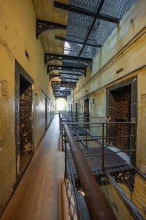 Worn prison scene with corridors and railings, Kilmainham Gaol prison, Dublin, Ireland