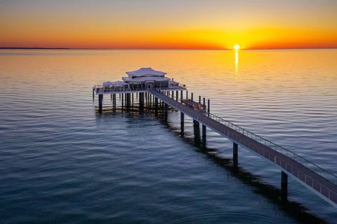 Aerial view over Seeschlösschenbrücke, jetty with restaurant Wolkenlos at Timmendorfer Strand,