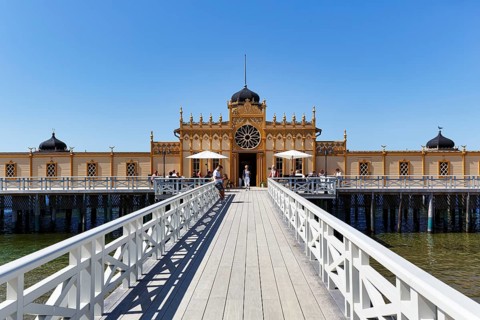 Wooden walkway to Kallbadhuset Varberg, traditional cold bath house and sauna, Moorish style, blue