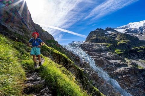 Mountaineers in front of picturesque high alpine mountain landscape with Lower Arctic Sea glacier,