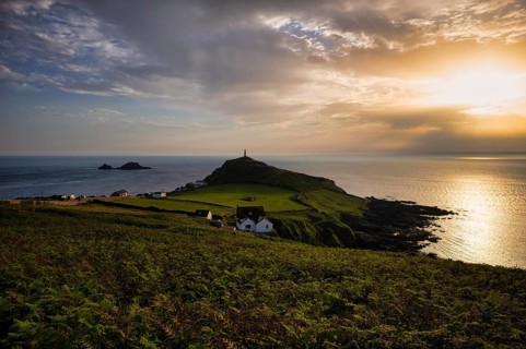 Chimney of a former mine, tin mine, copper mine, in memory of mining, Cape Cape Cornwall, behind