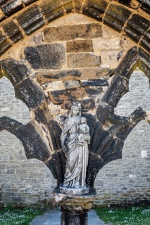 Historic Madonna statue in the ruins of Saint-Mathieu Abbey on the Breton coast, Pointe