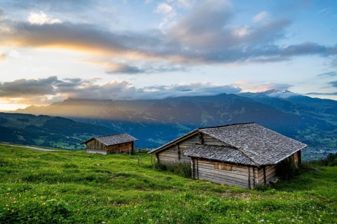 Alpine huts and alpine meadows, mountain landscape at sunset, Alpiglen, Grindelwald, Bernese