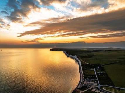 Sunset over Seven Sisters Cliffs from a drone, English Channel, East Sussex, South-east England