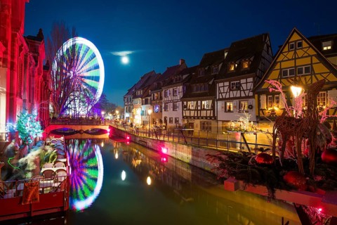Colourfully illuminated and Christmassy decorated half-timbered houses, old town, blue hour,