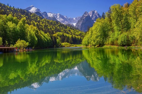 Riessersee with reflection in front of Alpspitze 2628m and Waxenstein 2277m in spring,