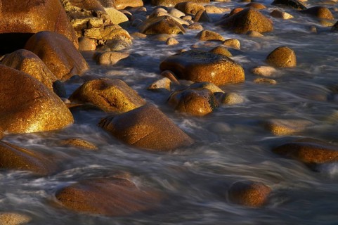 Stones, pebbles, pebbles, washed by water, motion effect, long exposure, evening light, Cot Valley