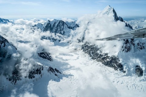 Summit of high mountains with glaciers, Mount Huntington on the right, 3731 m, aerial view, Alaska