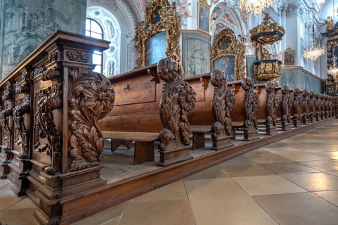 Decoratively carved cheeks of church pews, parish church of the Assumption of Mary, 17th century