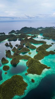Aerial view of tropical islands and turquoise lagoons, Wayag Archipelagio, West Papua, Indonesia