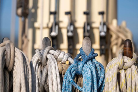Holpins or nail nails stuck through a board, including coffee nails, linen and ropes, sailing ship,
