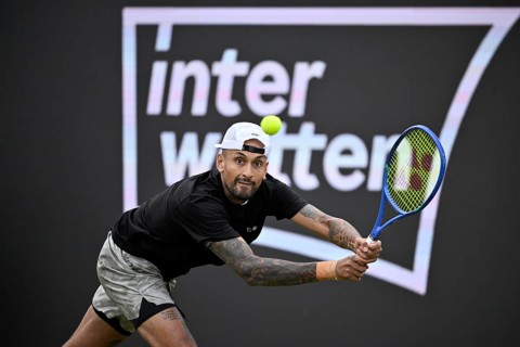 Nick Kyrgios (AUS) in action, with the INTERWETTEN BOSS Open 2026 logo on the backboard, ATP 250