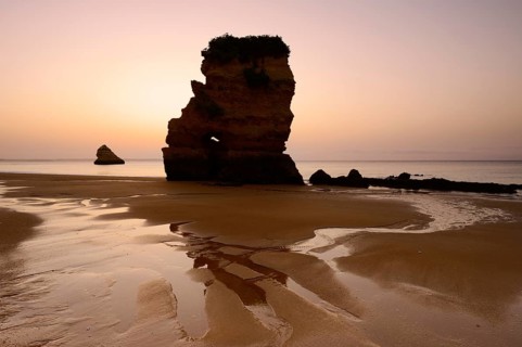 Rock formation on the beach at sunrise, Praia Dona Ana, Lagos, Algarve, Portugal