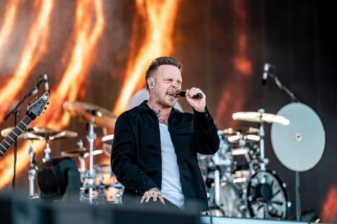 Singer Sam Carter from the British metalcore band Architects live on the Utopia Stage during the